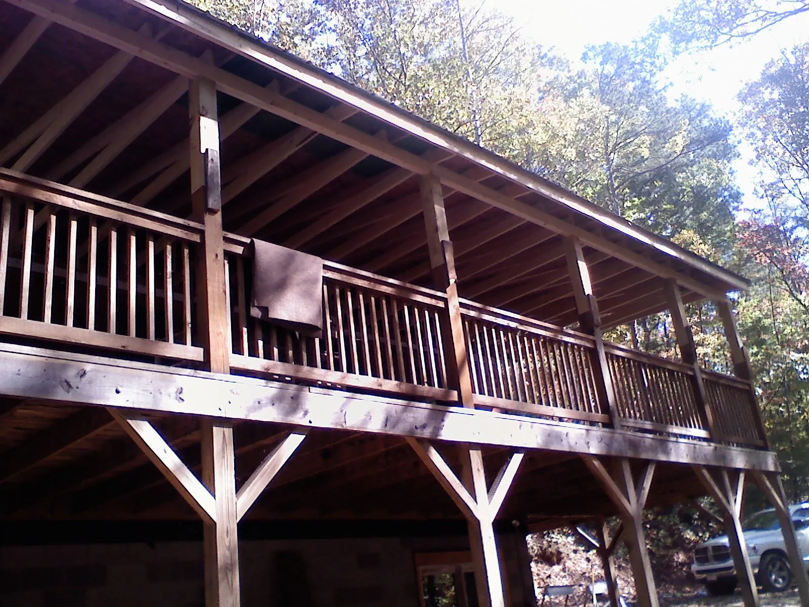 Timber framing under a new elevated porch and deck — Roof Leak Repair in Ellicottville by Roofing Brothers